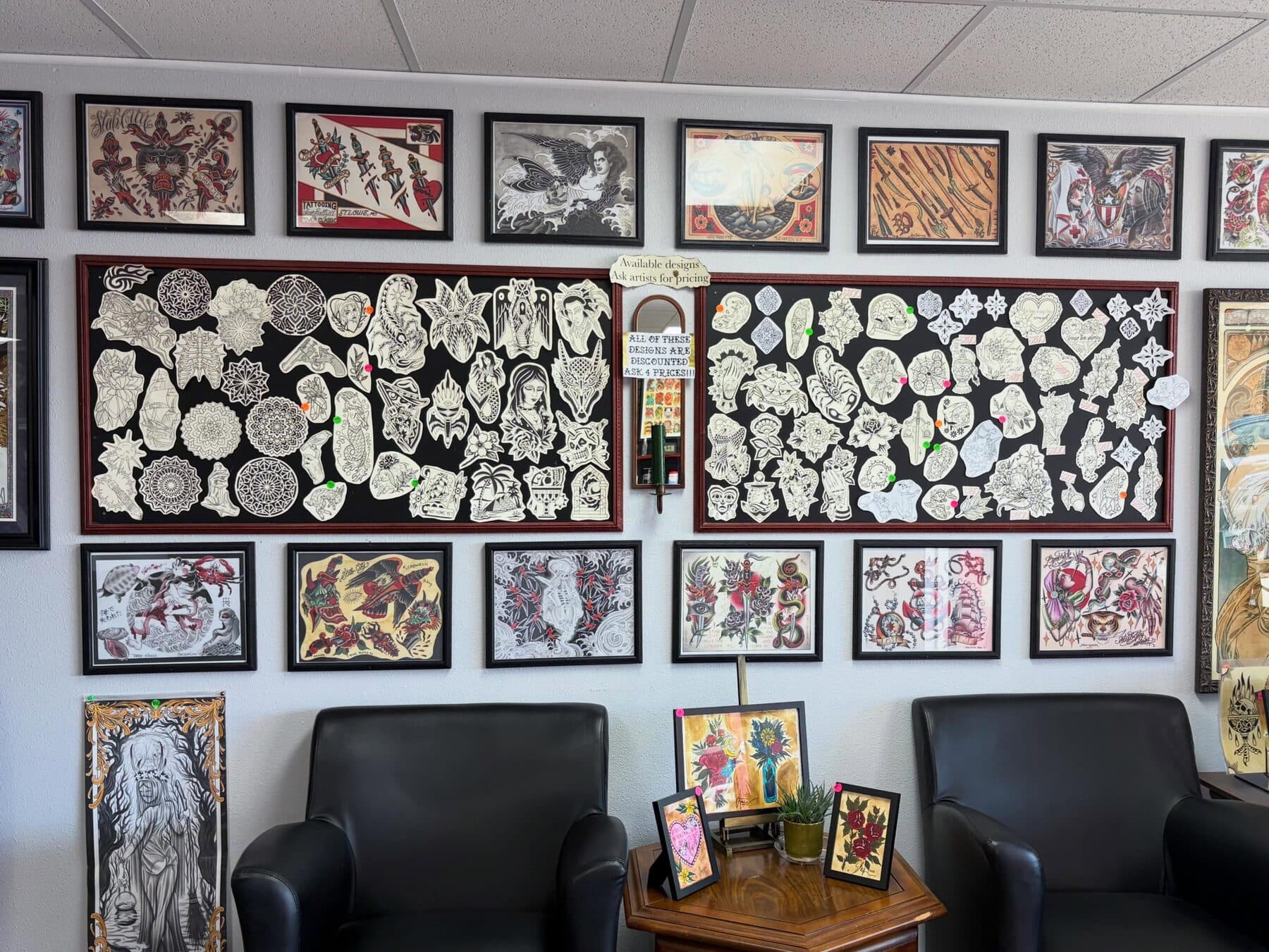 Flash designs and framed artwork covering the shop walls