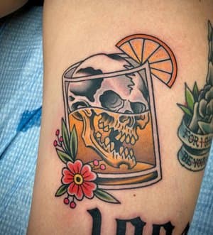 Whiskey glass tattoo by Mike Horman