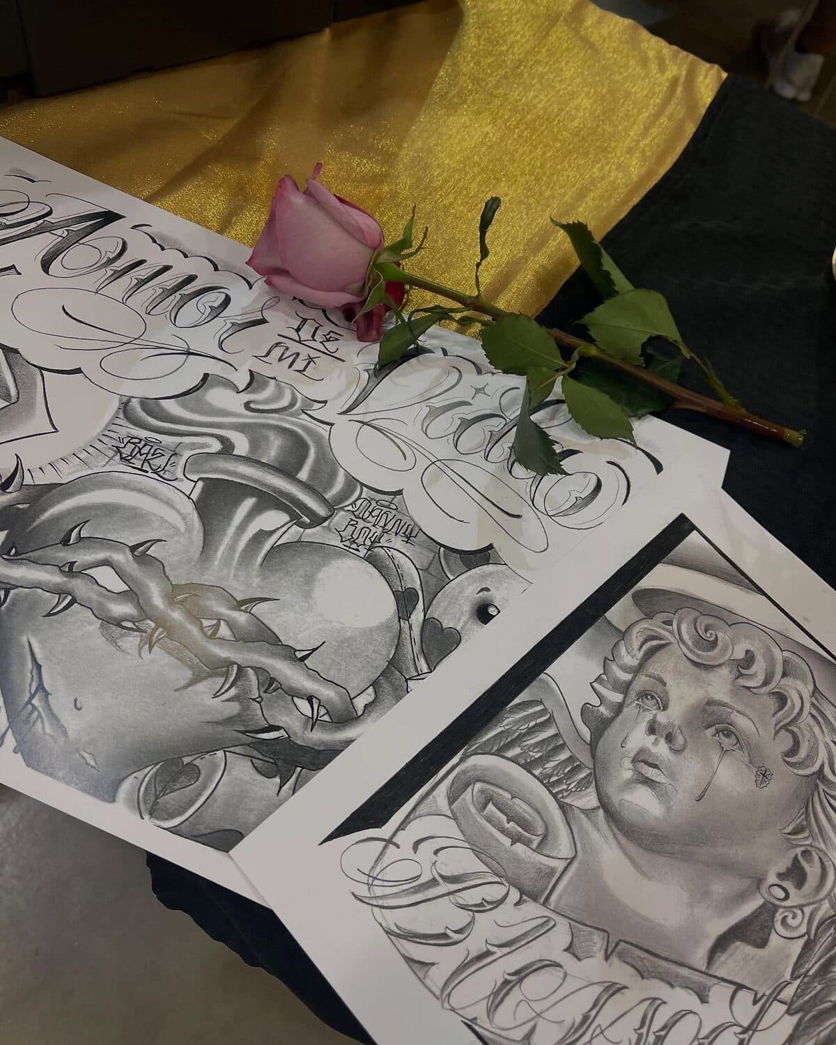 Tattoo design sketches in progress on the drawing table