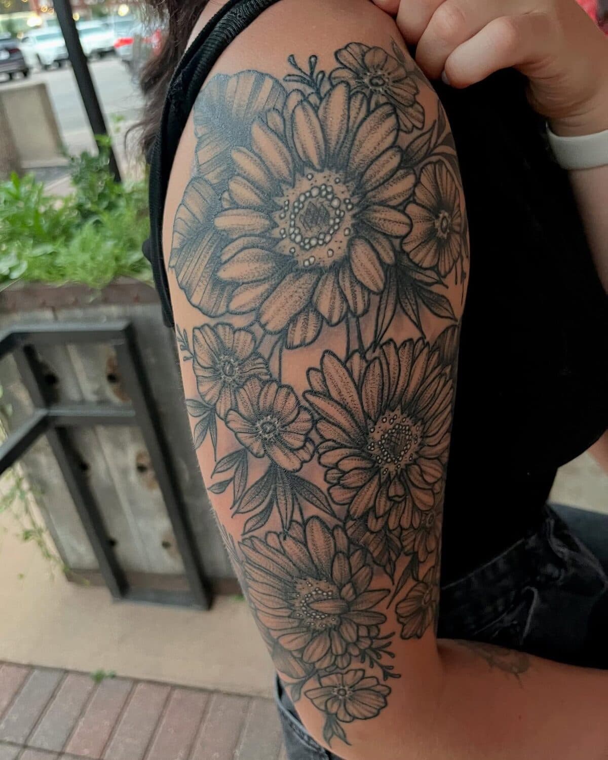 Sunflower and daisy arm tattoo